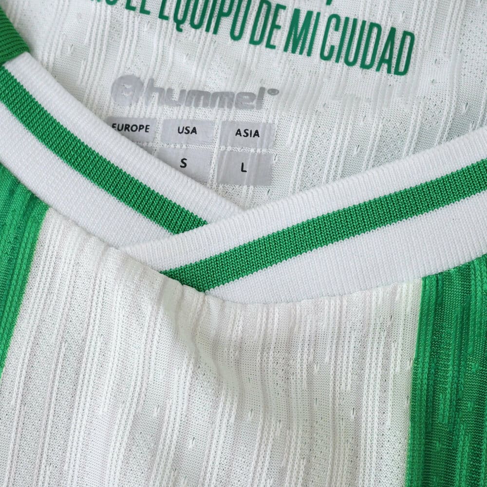 Close-up of the Real Betis 2025/26 Home Player Version jersey collar with Hummel branding.