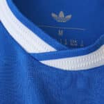 Close-up of the Real Madrid 2025/26 Third Player Version jersey collar in blue with white trim.