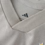 Close-up of the SL Benfica 2025/26 Away Player Version jersey collar showing mesh texture and Adidas logo.