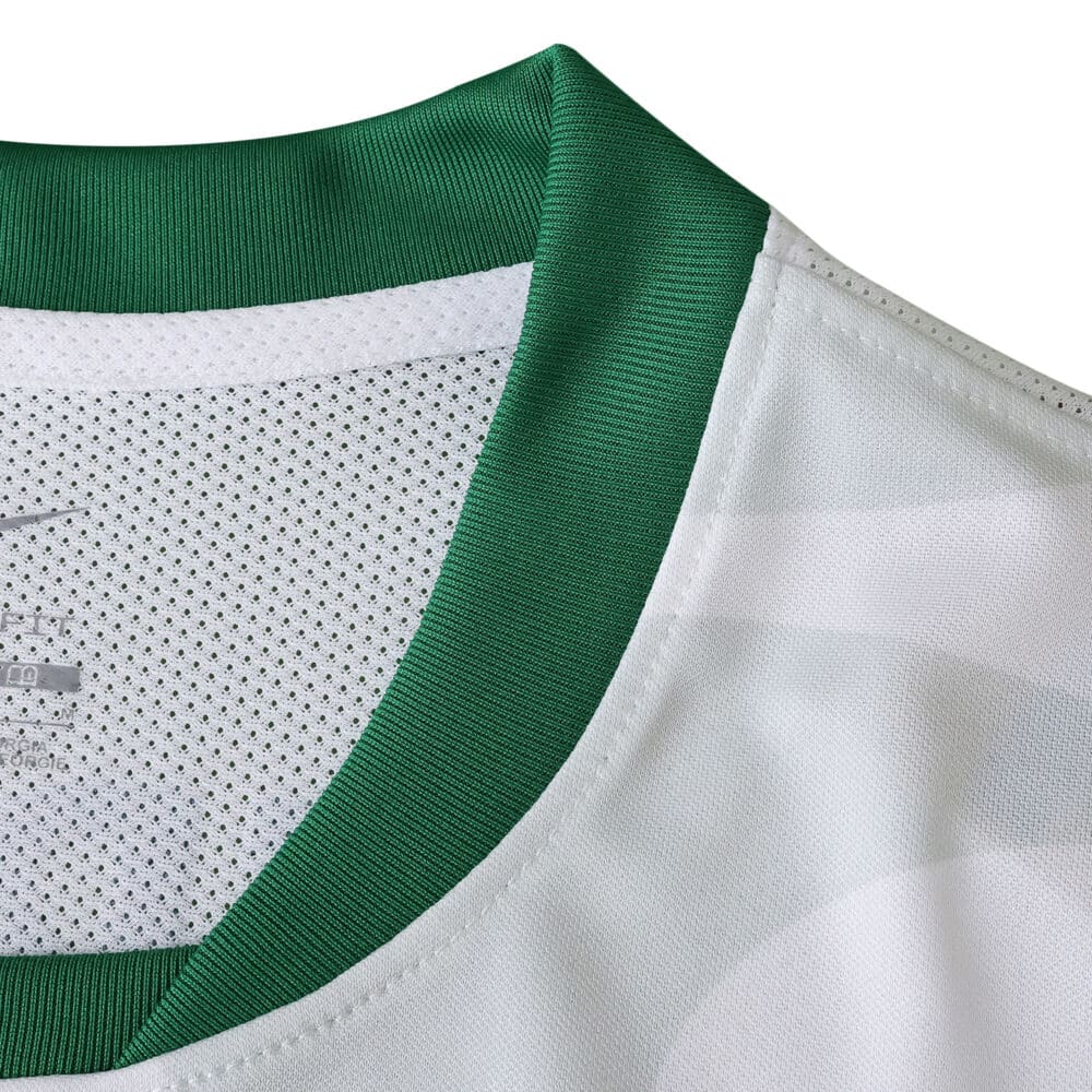 Close-up of Sporting CP Away 2025/26 fan jersey collar with green trim and white mesh fabric.