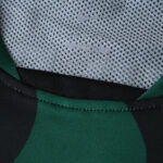 Close-up of Sporting CP Third 2025/26 Fan Version jersey collar with Nike logo on mesh fabric.