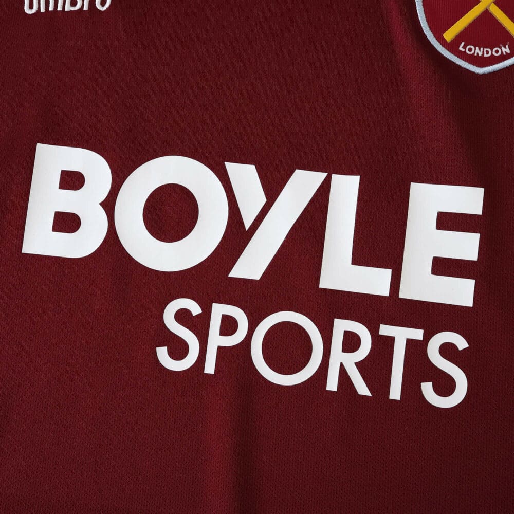 Close-up of West Ham United 2025/26 home fan jersey with BoyleSports sponsor logo and club badge.