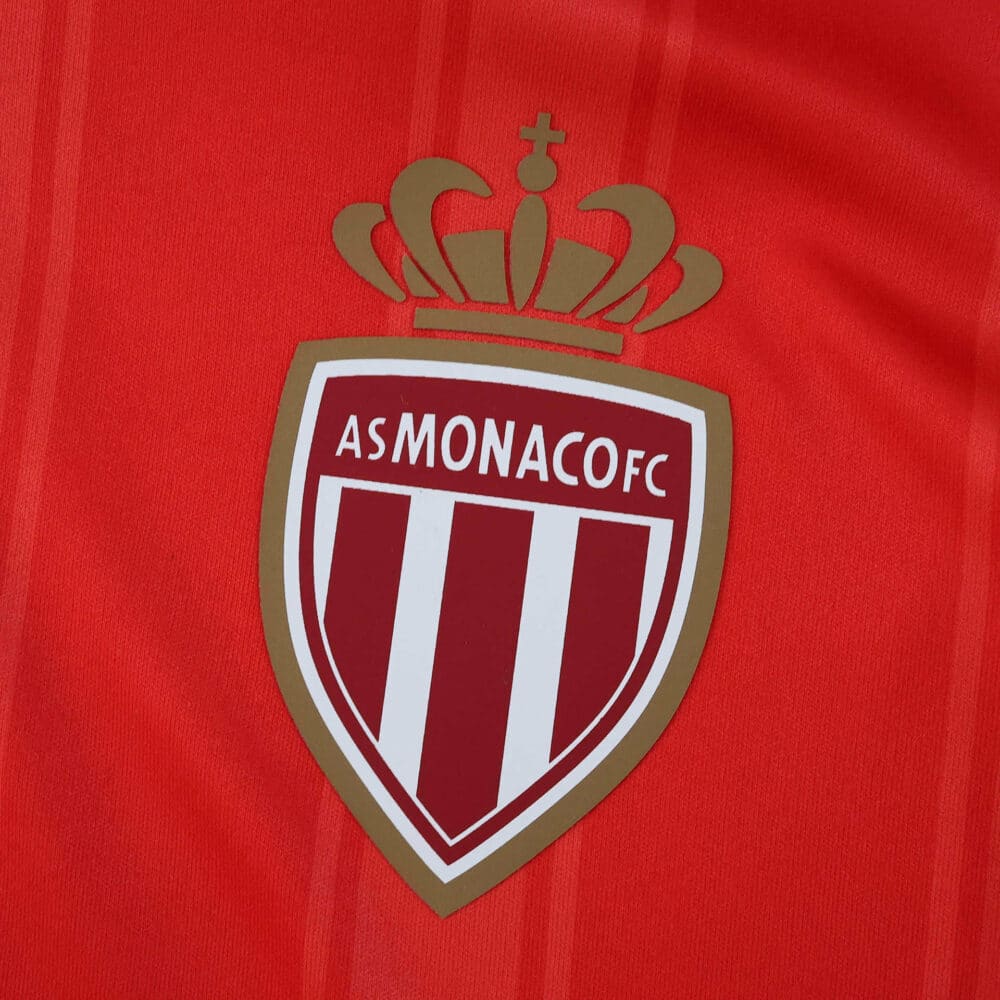 AS Monaco FC crest on the red 2025/26 home player version jersey.