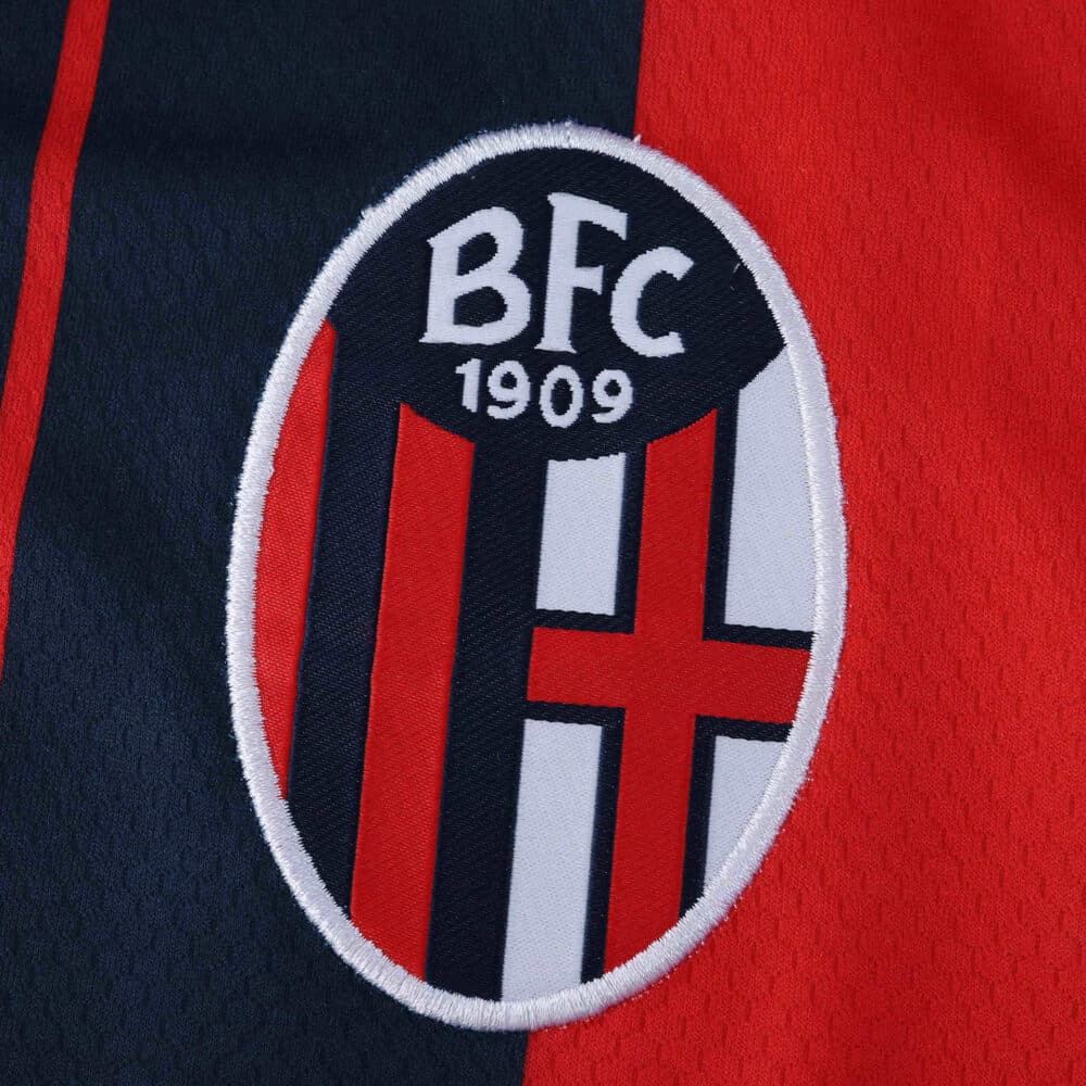 Close-up of the Bologna FC 1909 crest on the 2025/26 home fan version jersey.