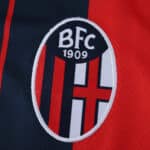 Close-up of the Bologna FC 1909 crest on the 2025/26 home fan version jersey.