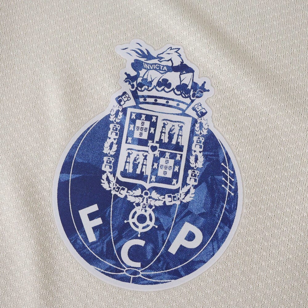 FC Porto 2025/26 Third Fan Version jersey badge with blue club crest on light fabric.