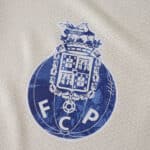 FC Porto 2025/26 Third Fan Version jersey badge with blue club crest on light fabric.
