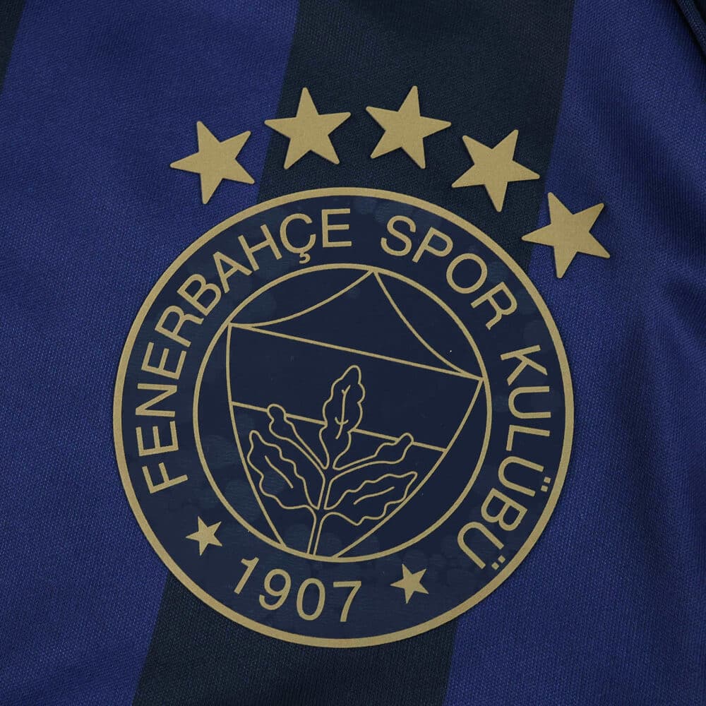 Fenerbahce Third 2025/26 Fan jersey badge with five gold stars and club crest on blue-black fabric.