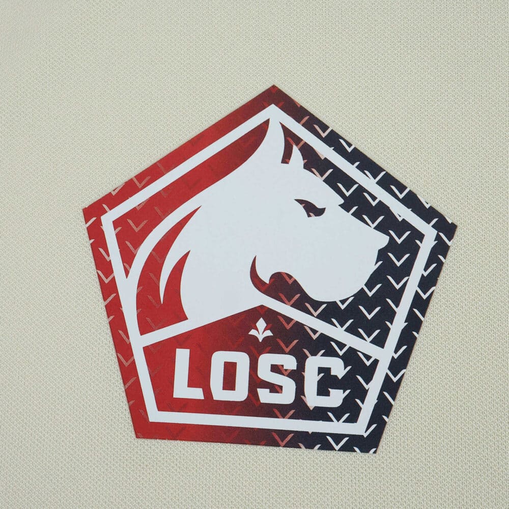 Lille LOSC Away 2025/26 fan jersey crest featuring a stylized dog head and red-black gradient design.
