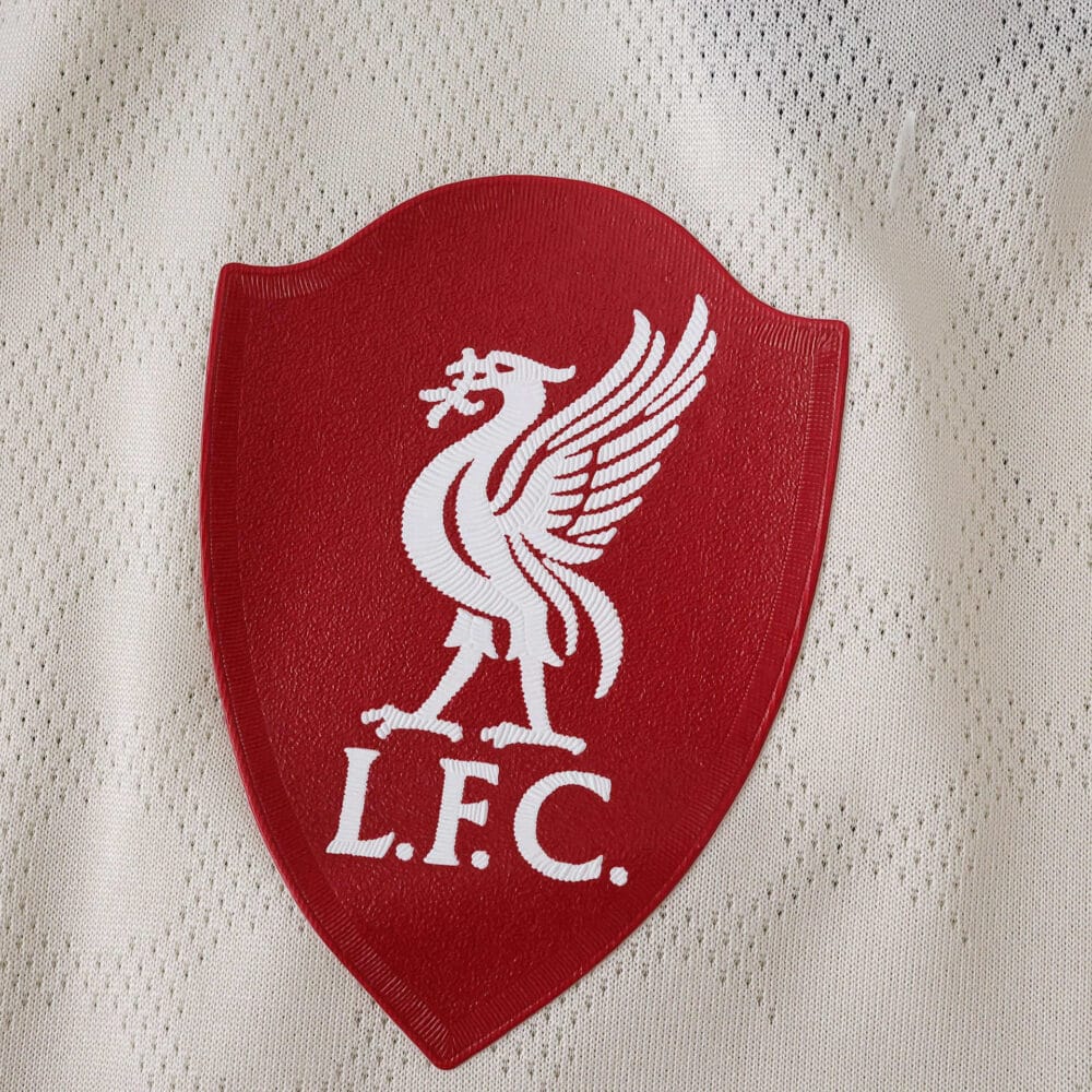 Close-up of the Liverpool FC crest on the 2025/26 away player version jersey.