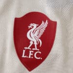 Close-up of the Liverpool FC crest on the 2025/26 away player version jersey.
