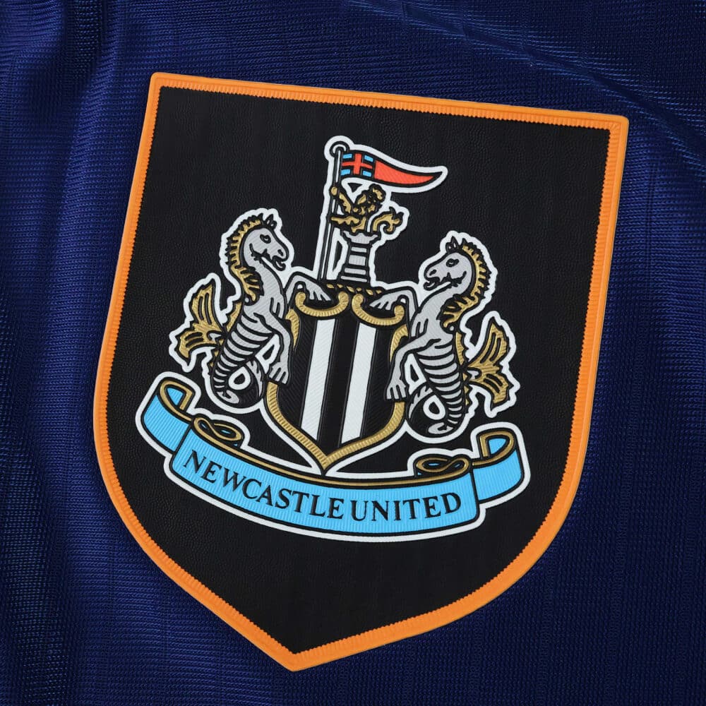 Newcastle United crest on the 2025/26 Third Player Version jersey, close-up view.