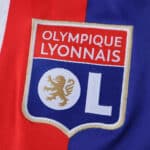 Olympique Lyonnais 2025/26 home fan version jersey featuring club crest on red and blue fabric.