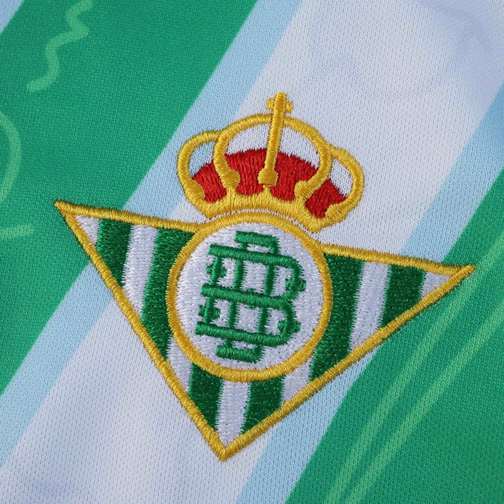 Real Betis crest embroidered on the 2025/26 away fan version jersey fabric.