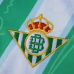 Real Betis crest embroidered on the 2025/26 away fan version jersey fabric.