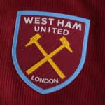 West Ham United 2025/26 Home Player Version badge on claret fabric with crossed hammers and London text.