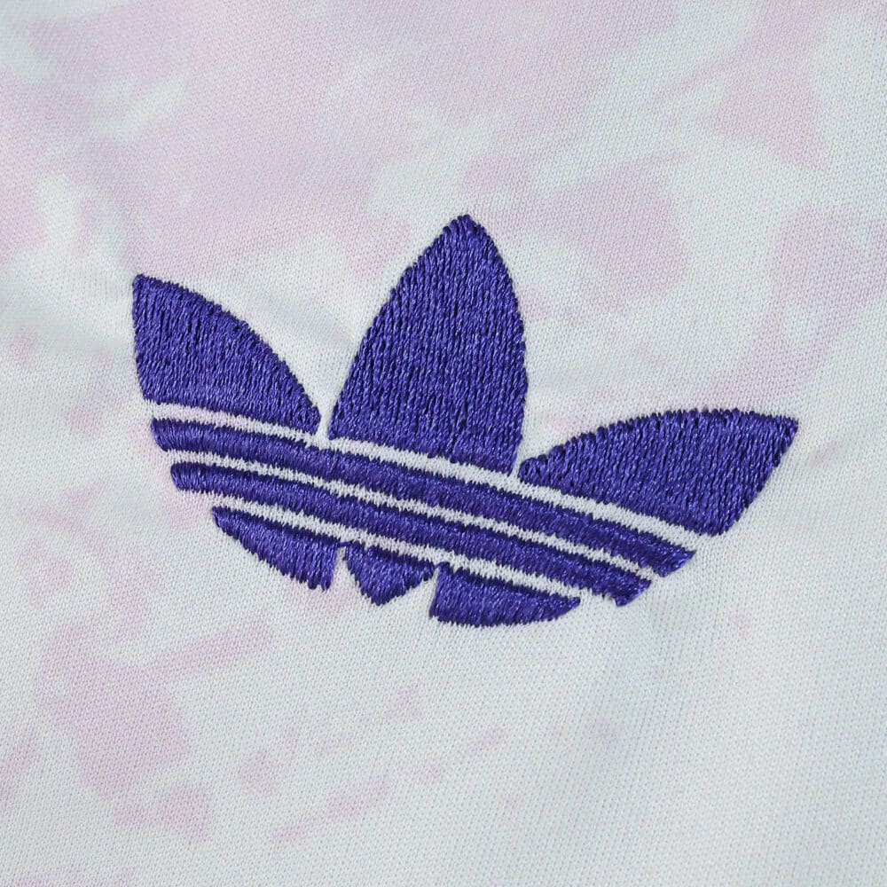 Purple Adidas Trefoil logo embroidered on the Aston Villa 2025/26 Third Fan Version jersey fabric.