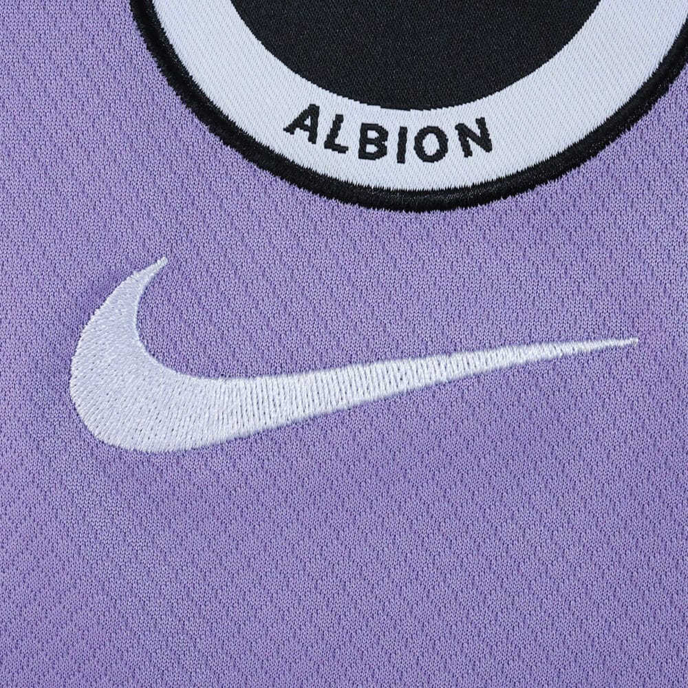 Close-up of the Brighton & Hove Albion 2025/26 away fan shirt with Nike logo on purple fabric.