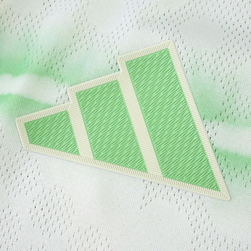 Close-up of the Celtic Third 2025/26 Player Version shirt featuring a light green geometric badge.