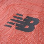Close-up of the New Balance logo on the FC Porto 2025/26 Away Player Version jersey fabric.