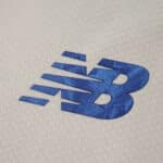Close-up of the blue New Balance logo on the FC Porto Third 2025/26 Fan Version jersey fabric.