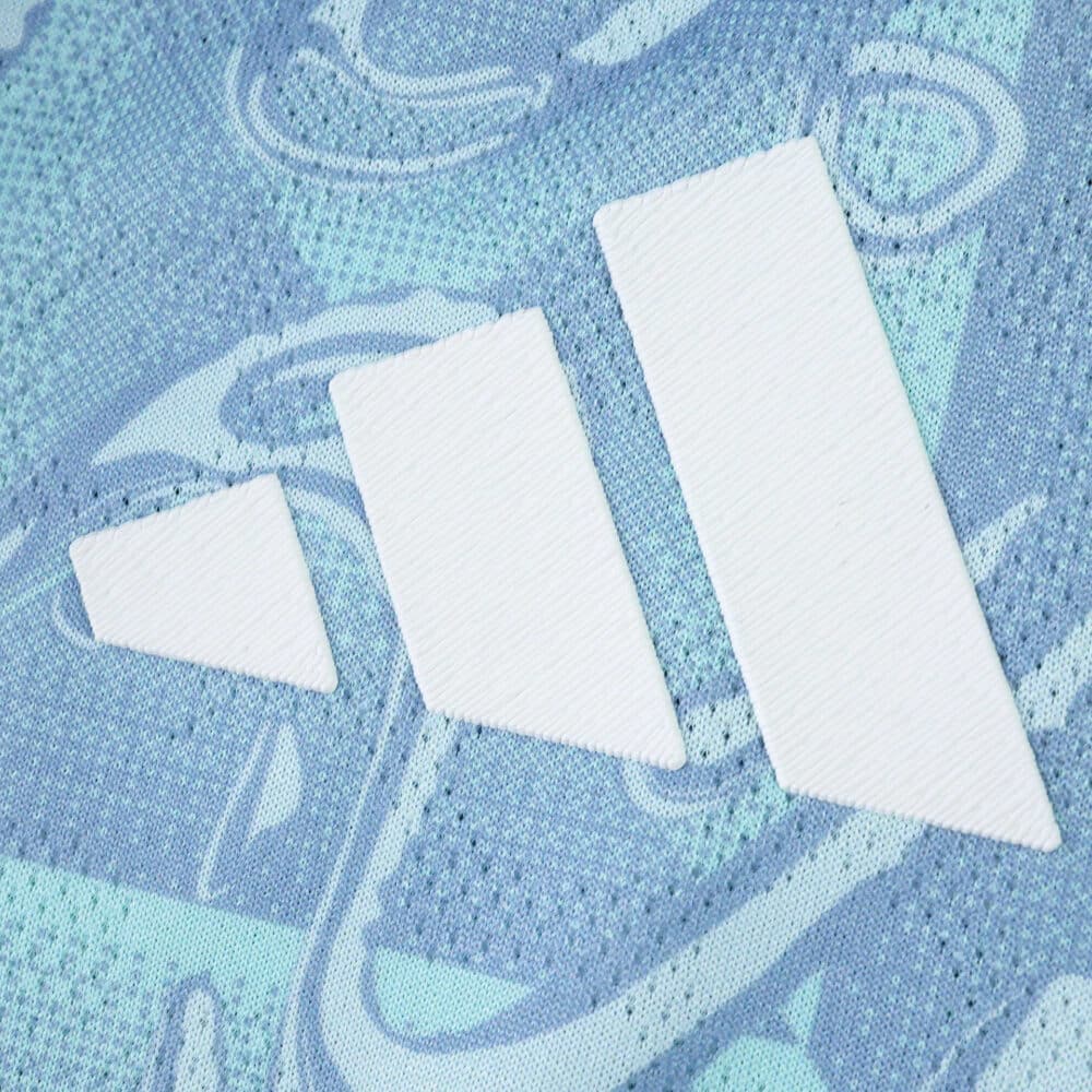 Close-up of the Adidas logo on the Juventus Away 2025/26 Player Version jersey in light blue fabric.