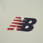 Close-up of the New Balance logo on the Lille LOSC 2025/26 Away Fan Version jersey.