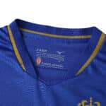Close-up of AS Monaco Away 2025/26 Fan Version jersey collar in blue with gold accents.