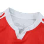 Close-up of AS Monaco 2025/26 Home Fan Version jersey collar with red and white design.