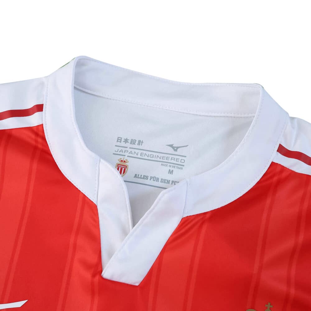 Close-up of AS Monaco 2025/26 Home Player Version jersey collar, showing red and white design with logo.