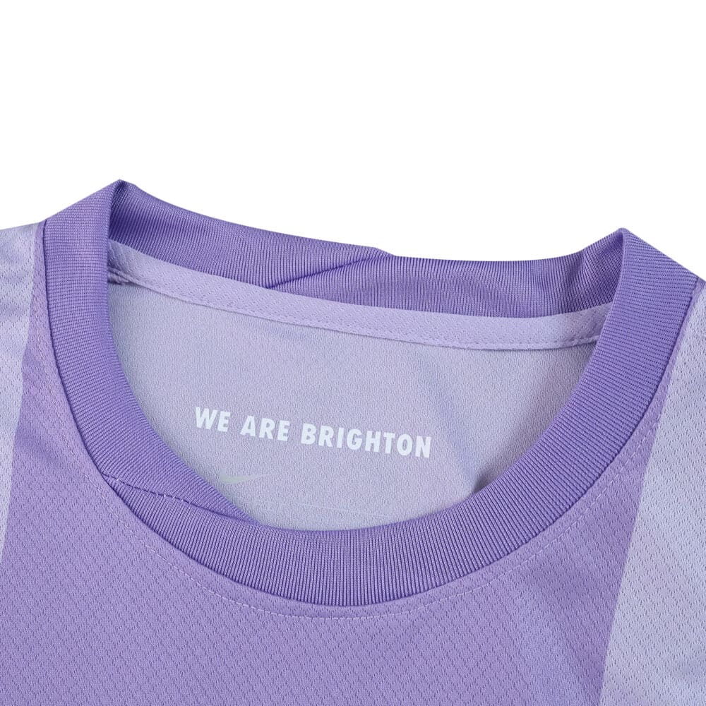 Close-up of the collar on the Brighton & Hove Albion 2025/26 Away fan jersey, showing "WE ARE BRIGHTON" text.