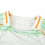Close-up of the Celtic Third 2025/26 Player Version jersey collar with green and orange accent stripes.