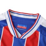Close-up of Crystal Palace Home 2025/26 Fan Version jersey collar with red, blue, and white stripes.