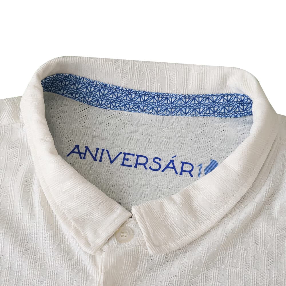 Close-up of FC Porto Third 2025/26 Player Version collar featuring blue "ANIVERSÁ" text inside.