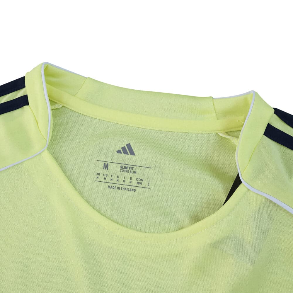 Close-up of Fenerbahce Away 2025/26 Fan Version jersey collar in light yellow with navy shoulder stripes.