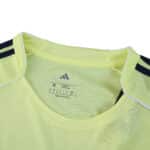 Close-up of Fenerbahce Away 2025/26 Fan Version jersey collar in light yellow with navy shoulder stripes.