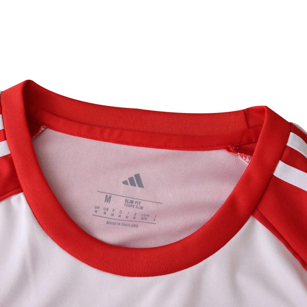 Close-up of the collar and shoulder detail on the Granada Home 2025/26 Fan Version jersey.