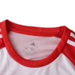 Close-up of the collar and shoulder detail on the Granada Home 2025/26 Fan Version jersey.