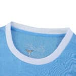 Close-up of Lazio Home 2025/26 Fan Version jersey collar with club emblem inside the neck.