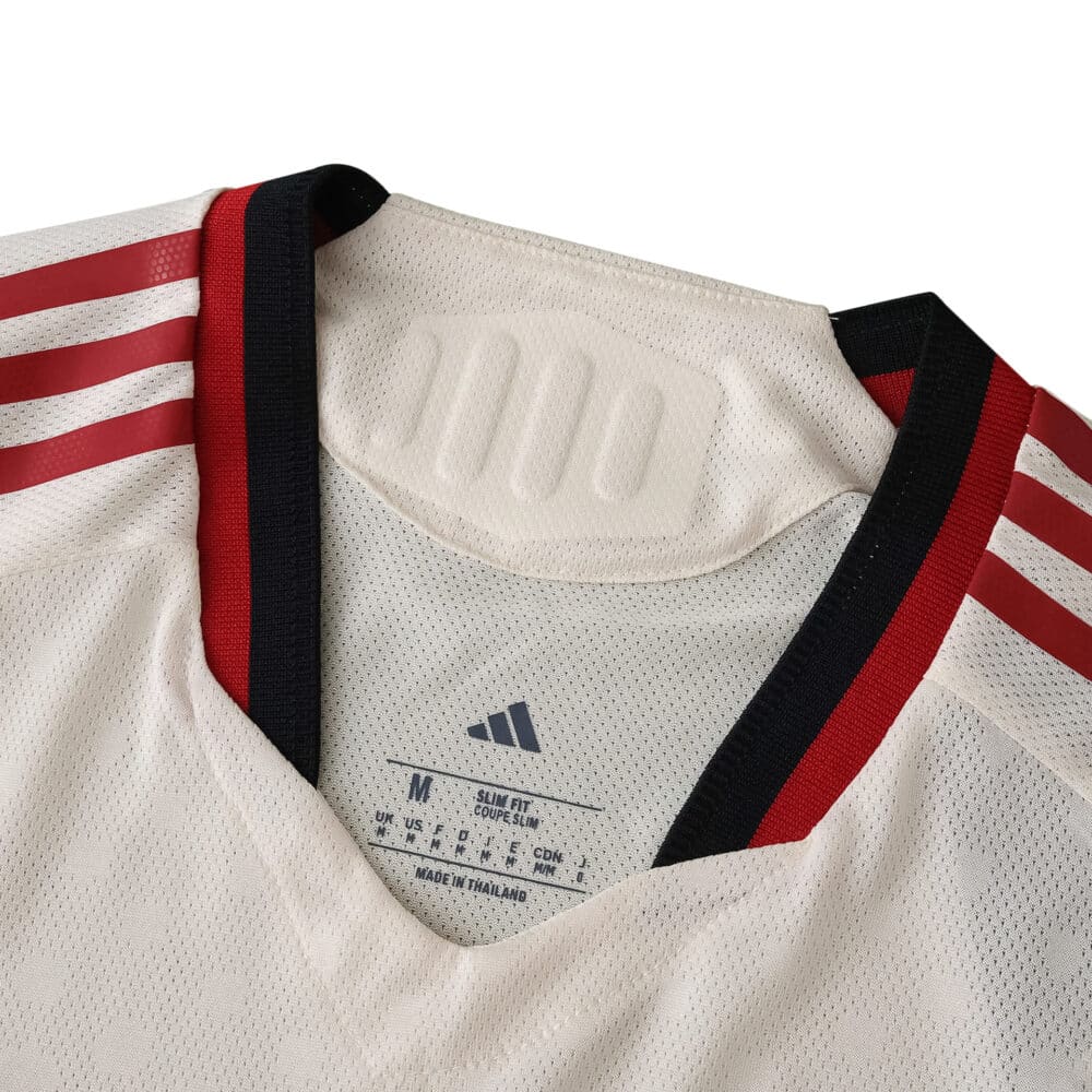Close-up of Liverpool Away 2025/26 Player Version jersey collar with red and black trim and Adidas logo.