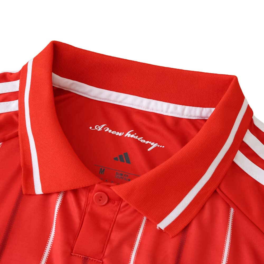 Close-up of the Nottingham Forest 2025/26 home fan jersey collar with white stripes and Adidas branding.