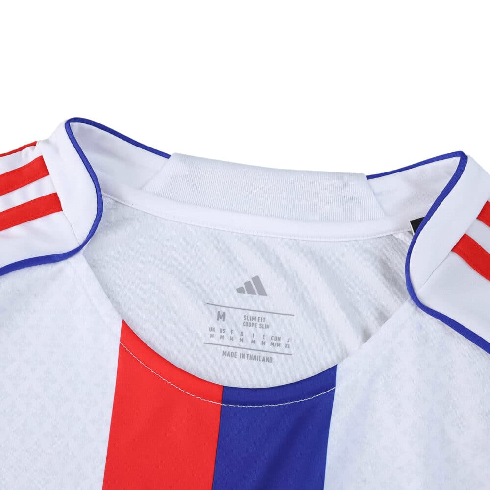 Close-up of Olympique Lyonnais 2025/26 home fan jersey collar, showing red stripes and blue-red central detail.