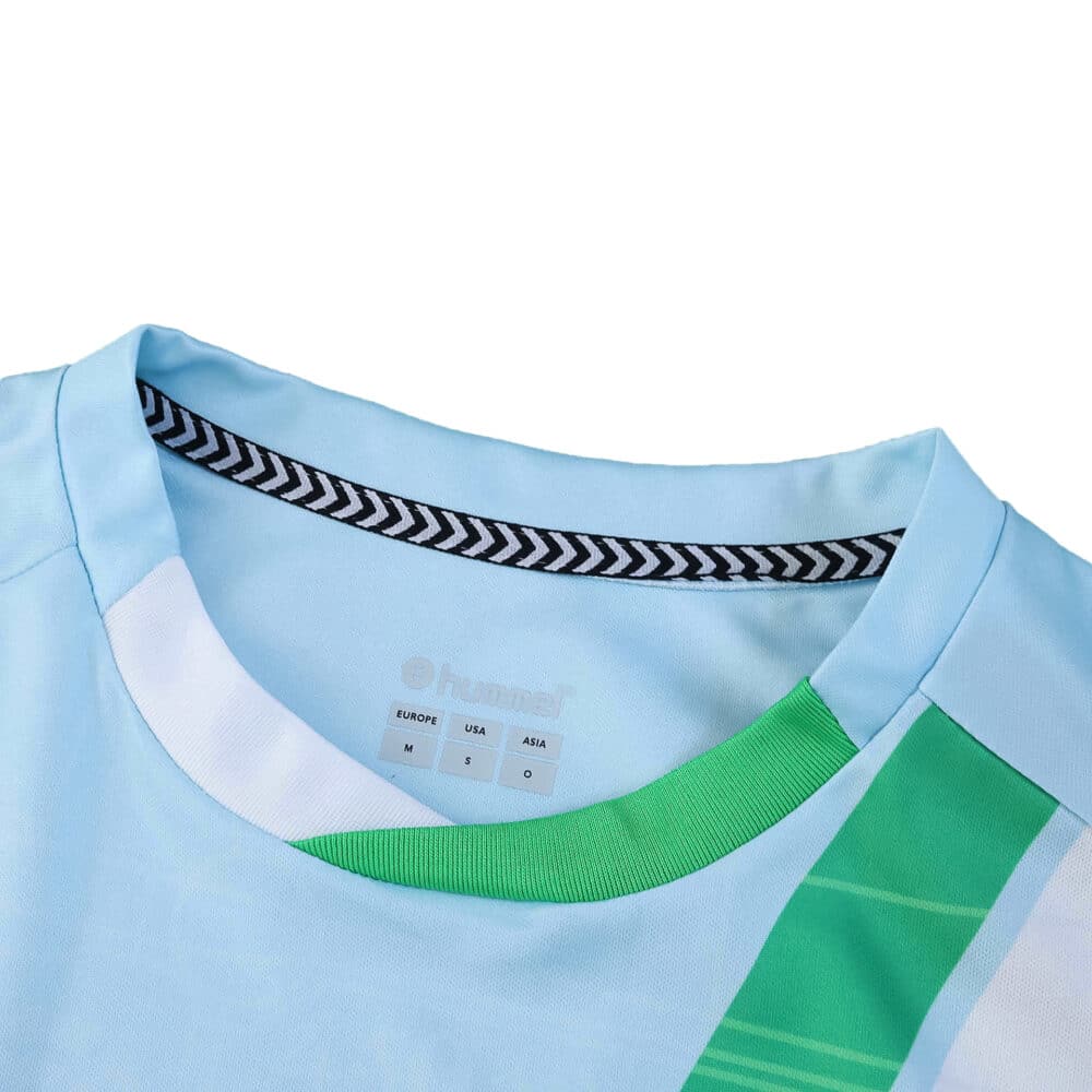 Close-up of Real Betis Away 2025/26 Fan Version jersey collar with blue, white, and green details.