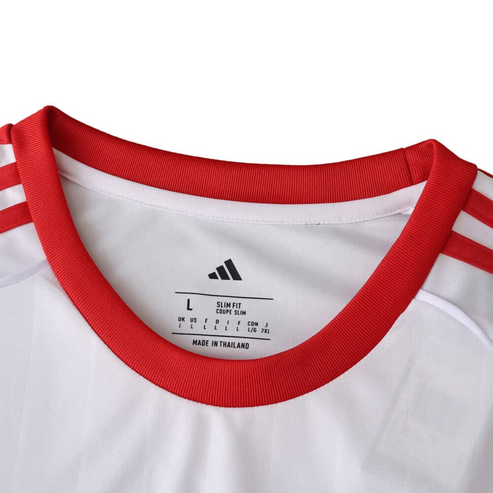 Close-up of the Sevilla FC 2025/26 Home Fan Version jersey collar with red trim and Adidas stripes.