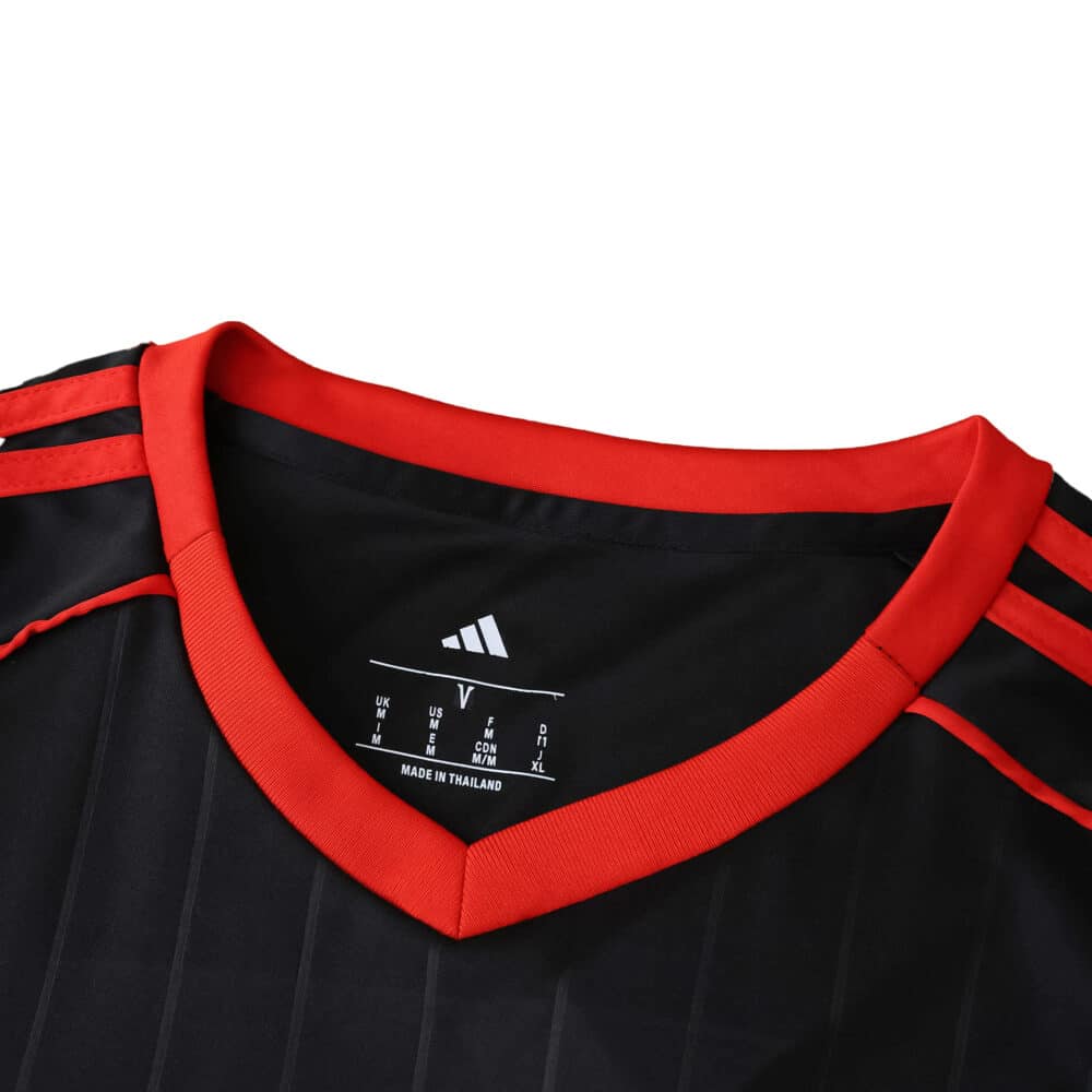 Close-up of Sevilla FC 2025/26 Third Fan Version jersey, showing red collar and Adidas logo on black fabric.