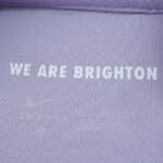 Detail of Brighton & Hove Albion Away 2025/26 Fan Version jersey with "WE ARE BRIGHTON" text inside collar.