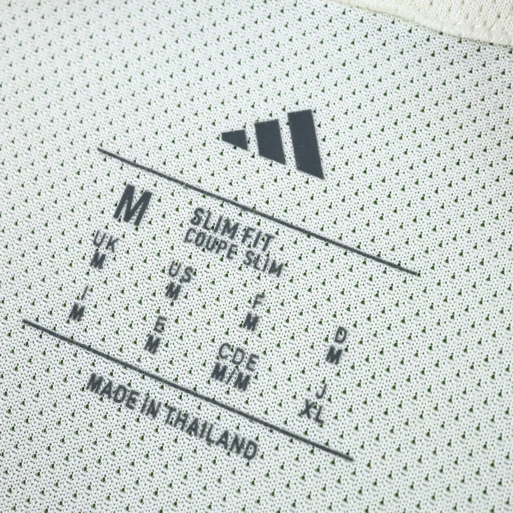 Celtic Third 2025/26 Player Version jersey inner label showing size M and slim fit details.