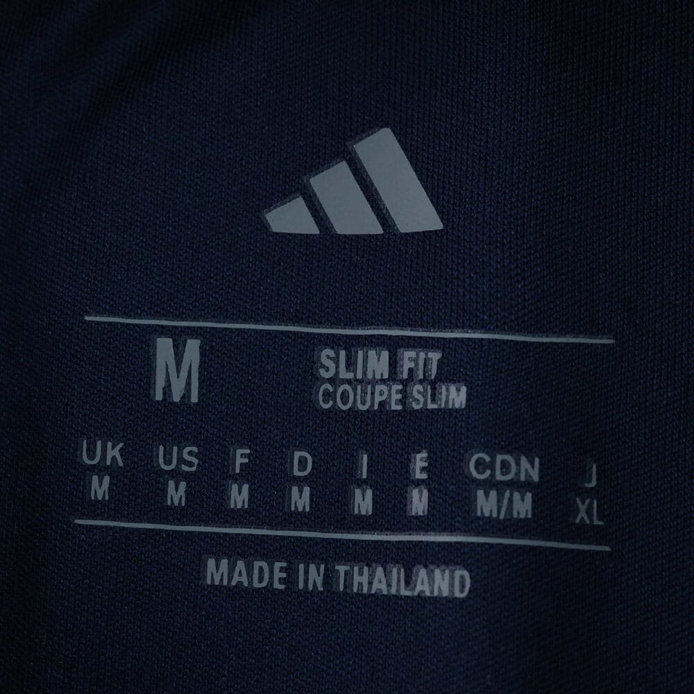 Adidas label inside Fenerbahce Third 2025/26 Fan Version jersey, showing size M and slim fit details.