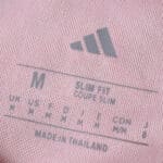 Close-up of the inner label on the Granada Home 2025/26 Fan Version shirt, showing size and fit details.