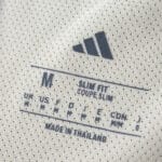 Close-up of the Liverpool Away 2025/26 Player Version jersey label showing size and Adidas logo.